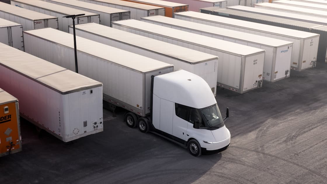 Electric semi truck charging at a depot