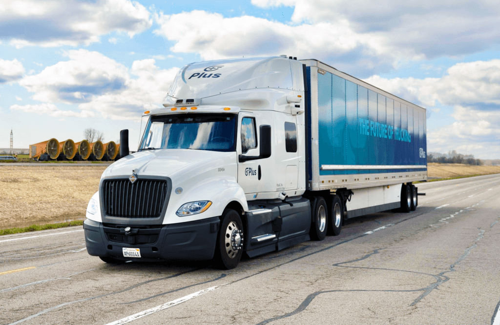 Autonomous Class 8 truck on a highway at dusk